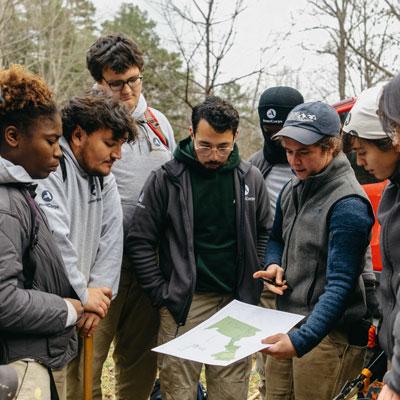 AmeriCorps NCCC members inspecting a map