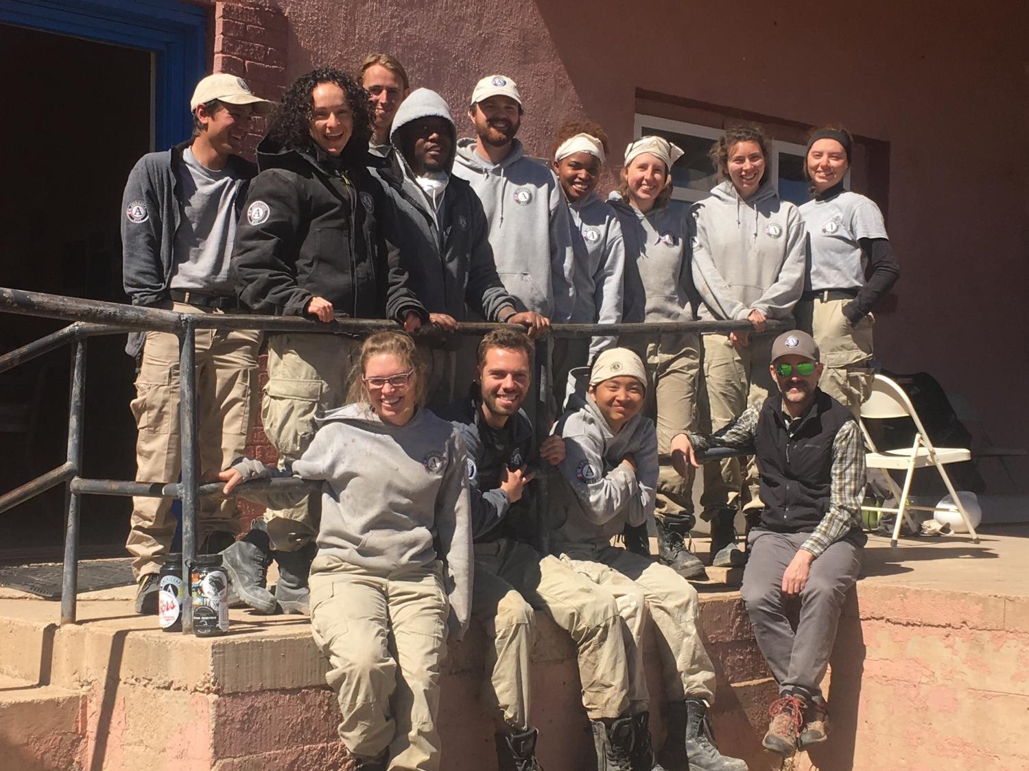 AmeriCorps team members gathering outside a work site