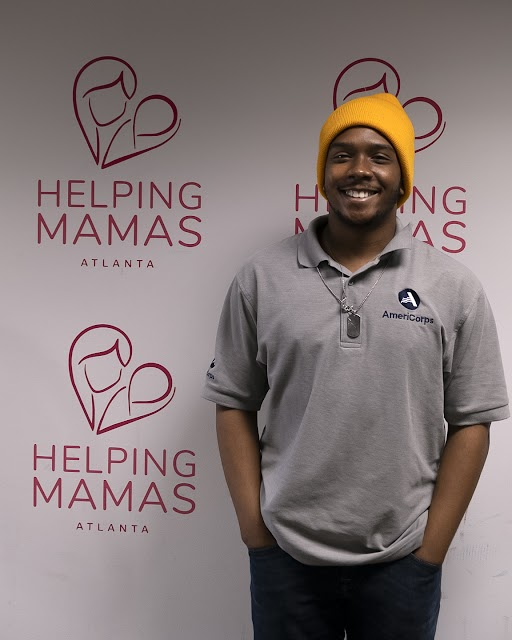 AmeriCorps Member David with Helping Mamas smiling