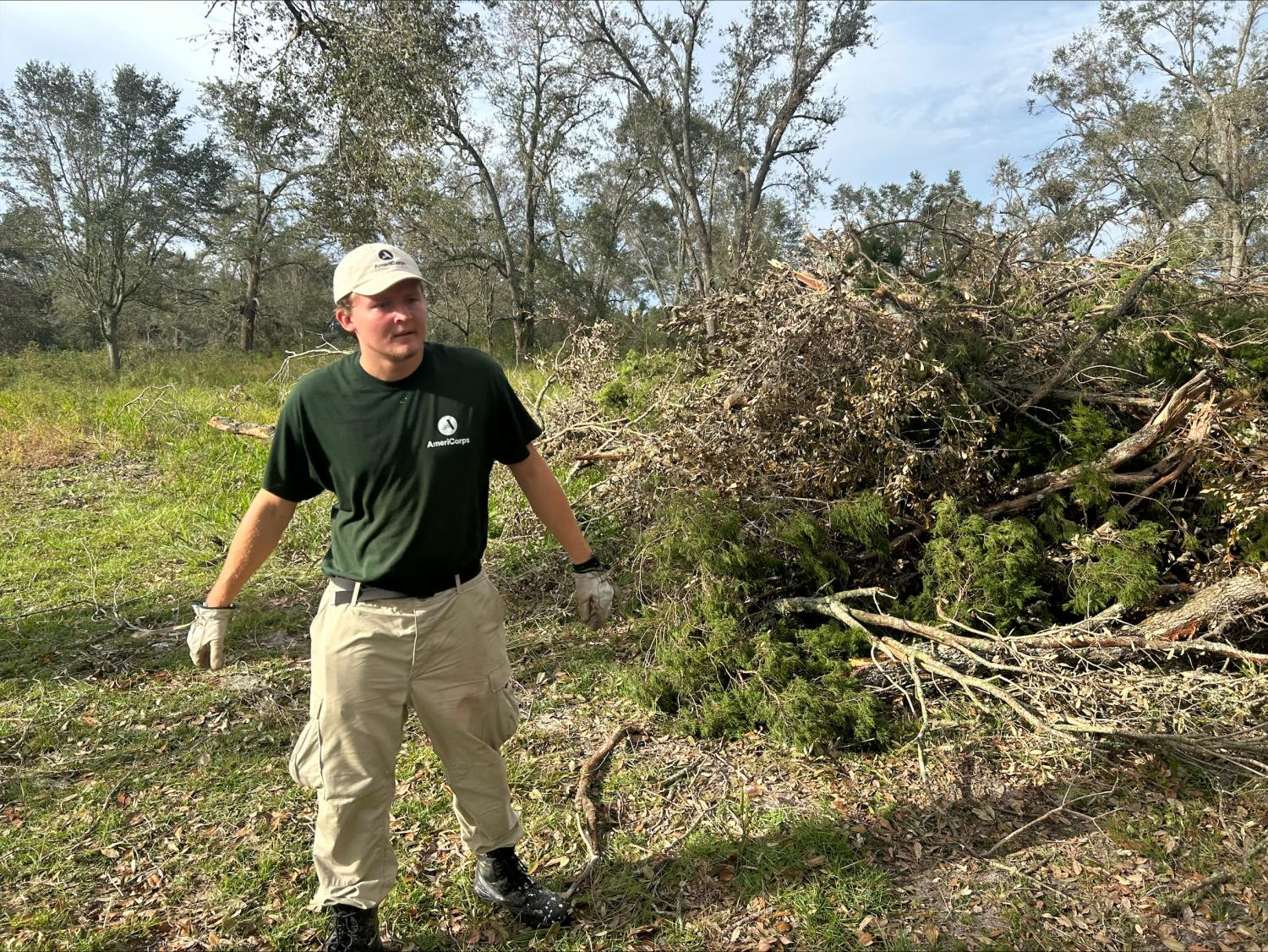 AmeriCorps NCCC member Austin removing hurricane debris