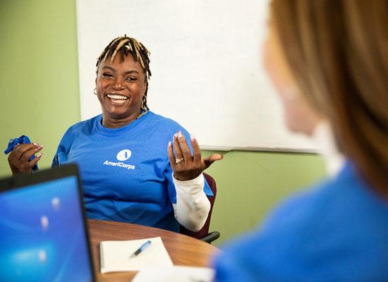 AmeriCorps members collaborating at a table